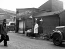 View: s19475 Shude Hill showing Sheaf Market (Fish Market), Wm. Bennett, fish and game dealer