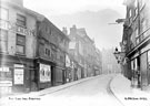 View: s19542 Snig Hill from West Bar, derelict timber framed shops, prior to demolition in 1900, left, premises on right include No 53, John Eaton, pawnbroker