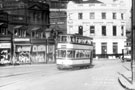 Tram No. 275 on Waingate, looking towards Bridge Street and Lady's Bridge Hotel. Premises on left include No 17, Colvin's, outfitters