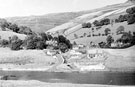 Derwent Village before being submerged by Ladybower Reservoir. St. James and St. John's C. of E. Church, right. Derwent Post Office and Vicarage, left