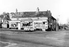 View: s21219 No. 286, J. Pearson, No. 288, A. S. and M. Bilby, Norwood Sub-Post Office and No. 290, Keneth Asher Ltd., butcher, Piper Houses, Herries Road and Hunfield House at the junction of Longley Lane