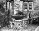 Old fashioned well with mullioned windows behind, Woodthorpe Hall, Holmesfield