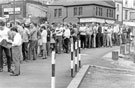 View: s22868 A Queue of striking miners outside a temporary Miners Welfare Centre on Bridge Street 