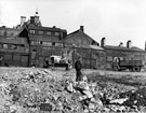 View: s23016 Demolition site of Walker and Hall Ltd., Electro Works with the rear of No. 139 Hattersley and Davidson Ltd., engineers, Norfolk Street backing on to Norfolk Lane  