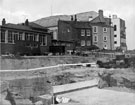 View: s23025 Construction of Arundel Gate with the rear of the Taxation Office on Eyre Street; Leader House and Cenral Library in the background