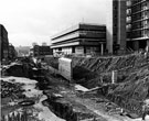 View: s23043 Construction of Furnival Square roundabout and underpass, Eyre Street showing Furnival House and multi storey car park and Nos.14/20 Savemore Discount Supermarket 