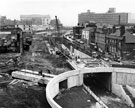 View: s23045 Construction of Furnival Square roundabout and underpass looking towards from Froggatt Lane, properties including the former premises of Oakes, Turner and Co. Ltd., bullion dealers towards Sheffield College of Technology