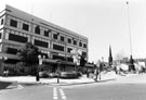 View: s23125 Paved area around Barkers Pool War Memorial with Cole Brothers in the background	looking towards Cambridge Street