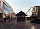 View: s23208 Bandstand on The Moor with G. A. Dunn and Co. (right); GT News; Zing Vaa Chinese Restaurant and Visionhire (left)