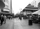 View: s23228 Bandstand and Moorfoot Market, The Moor showing Knightingales, Rockingham House (originally Roberts Brothers)