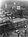 View: s23554 Elevated view of the extension construction to Hallamshire Hospital showing houses on Stone Grove; Tree Root Walk, David Morrison Research Department; Charles Clifford Dental Hospital and Weston Park Hospital in the background