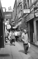 View: s23832 Shoppers in Chapel Walk showing No. 44, Limeys Ltd. and the entrance to the Victoria Hall