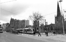 View: s23857 Supertram No. 16 at the Cathedral Supertram stop, Church Street with the Gladstone Buildings and Cathedral in the background 