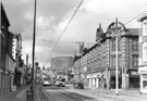 View: s23998 No. 60 Bus and Supertram No. 22 travelling along West Street with the Mail Coach public house left; Cavendish Buildings at the junction with Mappin Street right and Royal Hallamshire Hospital in the background