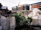 Yard at rear of Nos. 157 - 167 West Street, outhouses face the rear wall of the buildings on West Street, new buildings are on Fitzwilliam Street