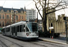 View: t02805 Supertram No. 13 on a test run to Meadowhall outside Cathedral Supertram stop showing the Gladstone Buildings and Cathedral, Church Street