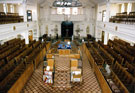 Interior of Wilson Road Synagogue looking towards the Ark showing the Reader's Desk in the centre of the hall, the mens benches and the womens gallery above