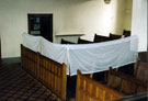 Interior of Wilson Road Synagogue showing the side gallery partitioned off for women