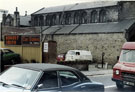 View: t03079 St. Matthew C. of E. Church, Carver Street from Division Street showing sign for Robert Smith, Car Sales and a private car park