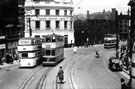 Sheffield Lane Top via Pitsmoor bound tram No. 118 and No. 17 bus on Waingate looking towards the junction with Bridge Street and Lady's Bridge with policeman on point duty showing Tennents Exchange Brewery and Lady's Bridge Hotel