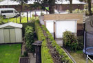 One of the original gate posts of Ballifield Hall in the garden of No. 96 Retford Road and one in the garden of No. 94 which is obscured by a bush