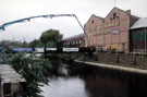 Construction of the Bailey Bridge, Five Weirs Walk across the River Don from Effingham Street to rear of T. W. Ward's, Albion Works, Savile Street