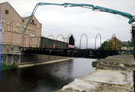 Construction of the Bailey Bridge, Five Weirs Walk across the River Don from Effingham Street to rear of T. W. Ward's, Albion Works, Savile Street