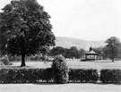 Looking towards the Bandstand, Hillsborough Park viewed through a window from the Library