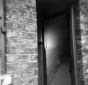 Back door showing cellar step and floor, house corner of Egerton Street