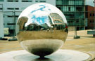 Reflections on the Stainless Steel Ball Sculptures entitled Rain by Colin Rose, Millennium Square