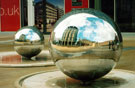 Stainless Steel Ball Sculptures entitled Rain by Colin Rose, Millennium Square with Peace Gardens, Town Hall and  Pinstone Street in the background