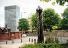 Pillars by Ross Gilbertson and Mandy Burton at the entrance to the Ponderosa, Crookes Valley Road/ Mushroom Lane with the Arts Tower and Weston Park in the background