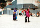 Aim to Dance, with Nisha Lal in the pink top, Chance to Dance, Tudor Square with the Crucible Theatre in the background during refurbishment