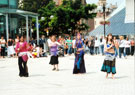 Aim to Dance, with Nisha Lal in the pink top, Chance to Dance outside Ruskins, Tudor Square with the Crucible Theatre in the background during refurbishment