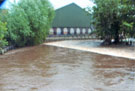 Debris left after the Flood of 25th June 2007 showing the River Don still running at a high level at Burton Weir