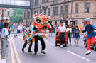 View: t04647 Chinese Lion on Norfolk Street during the World Student Games Cultural Festival Opening Procession with the Town Hall in the background