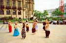 Zubaidah performing in the Peace Gardens during the Chance to Dance Festival with the Winter Garden under construction right