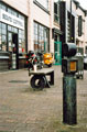 Bollard by David Mayne and Bench by Darren Richardson outside Sound Control, musical instrument shop and Workstation, Paternoster Row