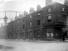 Earl Street showing derelict properties at junction of Eyre Street. Gasometer in background