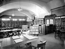 Adult Library, Woodhouse Branch Library, Tannery Street (spring blinds cover bookshelves to convert into reading room)