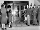 Queue of borrowers waiting to go into Central Lending Department, Central Library, Surrey Street, at 10 o'clock