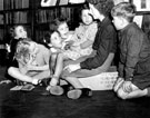 View: u02995 Story hour, Miss Rhodes telling a story to the children in the Junior Library at Hillsborough Branch Library, Middlewood Road