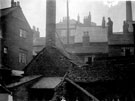 Rear of buildings facing Campo Lane, showing different heights of roofs