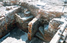 Archaeological excavations revealing cellars of houses on the corner of Burnt Tree Lane