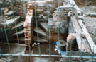 Archaeological excavations revealing cellars of houses on the corner of Burnt Tree Lane