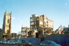 Demolition of part of Jessop Hospital for Women from Brook Hill with former St. George  C. of E. Church now used as a Lecture Theatre and University of Sheffield student accommodation in the background