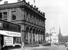 No. 14, National Sight  Testing Service, opiticians and Sheffield Transport  Department, Traffic Office, Division Street decorated for Transport Jubilee July 1946 with Cinema House, Barkers Pool in the background