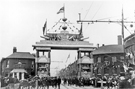 View: u05676 East End decorative arch, Savile Street East for the royal visit of King Edward VII and Queen Alexandra with Thomas Firth and Sons, West Gun Works right and No. 208, Norfolk Arms, Joseph Badger victualler left 