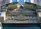 Carved detail over the doorway of the the former Howard Gallery, No. 23 Chapel Walk