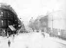 Laying of tram tracks at bottom of South Street, Moor, from junction of Ecclesall Road, Nos. 215-221, James Lamb and Son, drapers, right, railings on right belong to Brunswick Wesleyan Church, No. 210 Shepherd Sawer, confectioner